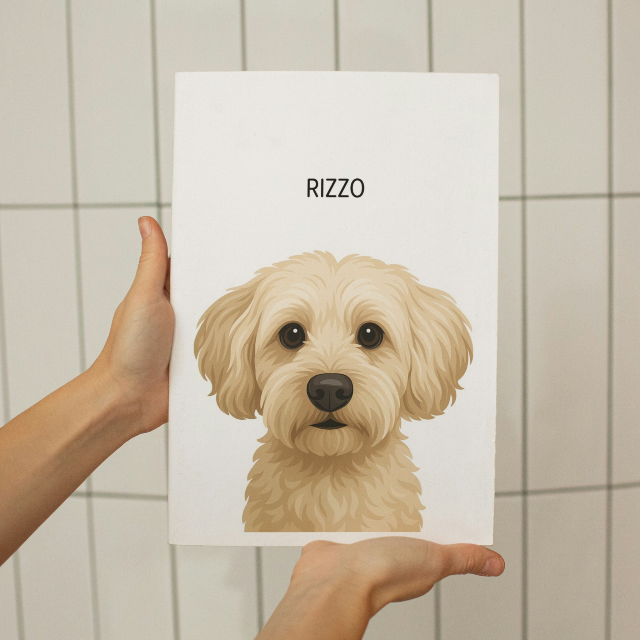 Card with a dog illustration and 'RIZZO' text held by a person against a tiled wall.